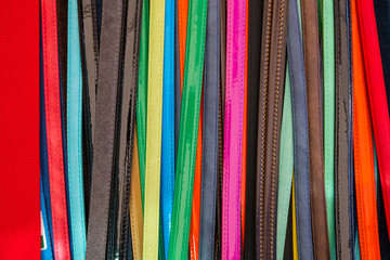 Colorful leather belts for women and men.