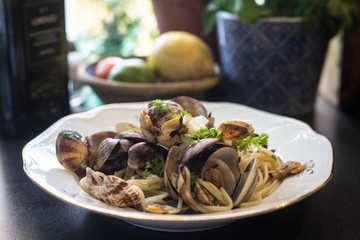 A plate with fresh delicious spaghetti with sea food. Vongole 