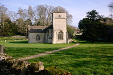 Fototapeta na wymiar Picturesque village church at Eastleach Martin in spring sunshine, Gloucestershire, UK