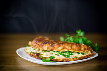 fried omelet with cauliflower and greens in a plate