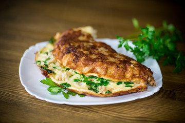 fried omelet with cauliflower and greens in a plate