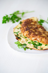 fried omelet with cauliflower and greens in a plate