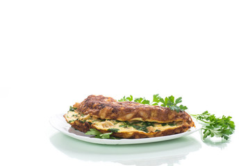 fried omelet with cauliflower and greens in a plate
