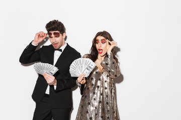 Beautiful young smartly dressed couple standing