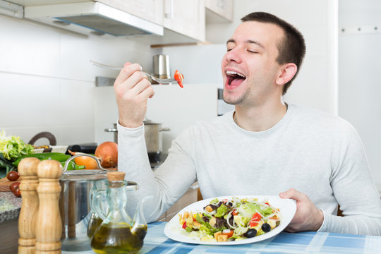 Adult guy having healthy lunch