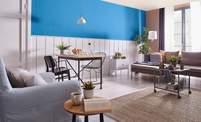 Decorative white and blue living room armchair table grey sofa style.