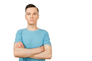 Portrait of young guy with crossed arms isolated on a white background.
