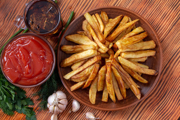 French fries on wooden table Selective focus, low key.