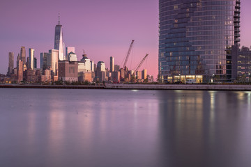 Fototapeta na wymiar View on finance district Manhattan and Jersey city skyscrapers at sunset from Hudson river