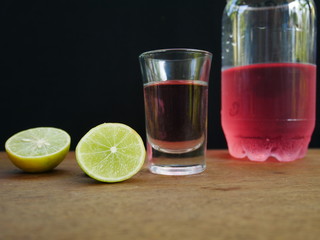 red soda with lemon and mint