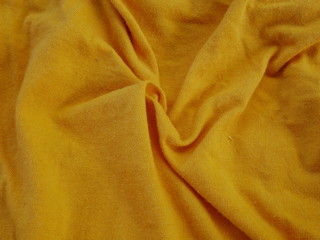 yellow silk fabric background,texture of cotton cloth,clothing satin