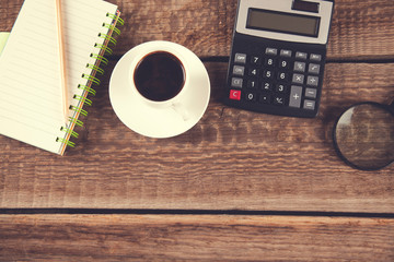 notepad and coffee with calculator