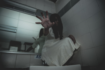 Portrait of asian woman make up ghost face with blood,Horror scene,Scary background,Halloween...