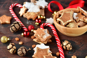 christmas card with cookies in the shape of stars decor gold, with candy,  pine cones, and  balls yellow and red, Christmas 2019, new year is 2019, selective focus