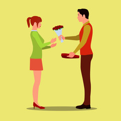 A man gives his girlfriend flowers and a box of chocolates. A loving couple on Valentine's Day exchange gifts.