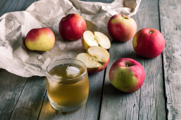 Naklejka na ściany i meble A glass of apple juice and fresh apples