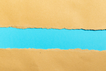 torn paper on blue background