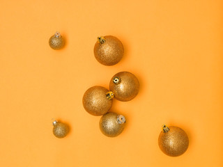 wonderful, gold christmas baubles on gold background