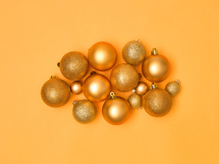 wonderful, gold christmas baubles on gold background