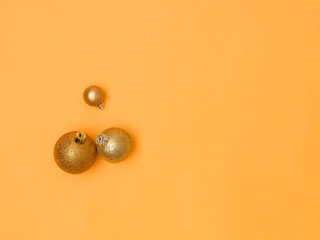 wonderful, gold christmas baubles on gold background
