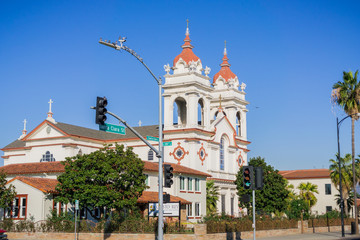 Fototapeta na wymiar Five Wounds Portuguese National Church, the Portuguese parish in San Jose, California; blue sky background