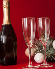Wineglasses on red christmas background.
