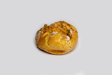one rustic bread rolls against white background