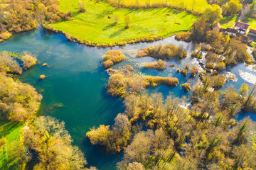      Croatia, Mreznica river from air, panoramic view of Belavici village and waterfalls in autumn 