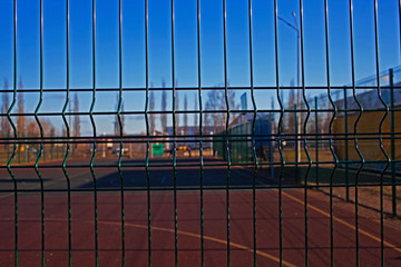 basketball court through the fence