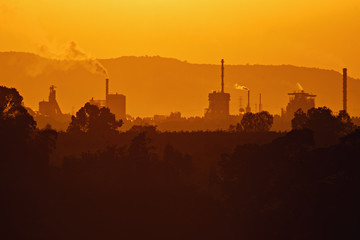 industrial factory with sunset(มลภาวะ)
