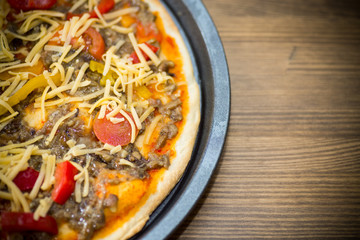 homemade pizza with forest mushrooms, peppers and tomatoes
