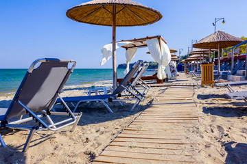 Wooden trail on the sandy beach