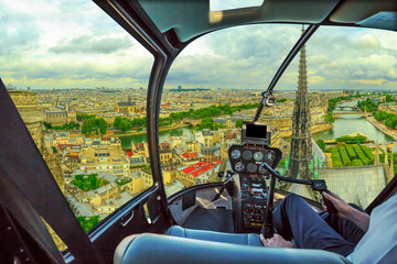 Helicopter cockpit flying on Pont Saint-Michel bridge on Senna river of Paris, French capital, Europe. Scenic flight above Paris skyline.