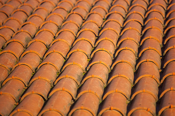 Old red tiles roof background, house roof