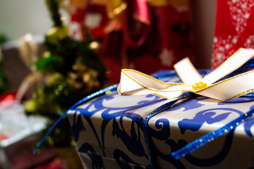 Festive christmas gifts are colourfully packed in a varicoloured paper..