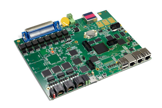 Electronic printed circuit board with chips and other components, green color, angled view, isolated on white