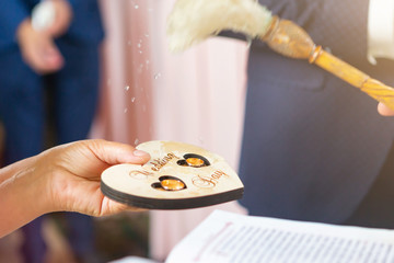 the priest sanctifies the wedding rings of the newlyweds in the church