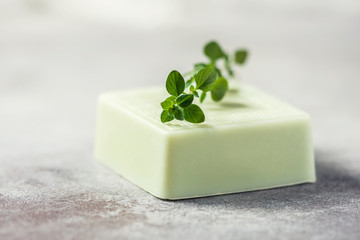 Bars of handmade soap with thyme, the concept of spa and health.