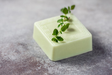 Bars of handmade soap with thyme, the concept of spa and health.