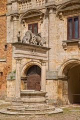 Old water well on Piazza Grande. The renaissance well with two lions on the Piazza Comunale in Montepulciano, Tuscany, Italy