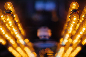 Old bulb with bokehs in festival. Background.