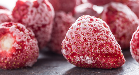 Close-up frozen strawberries covered by frost. - Powered by Adobe