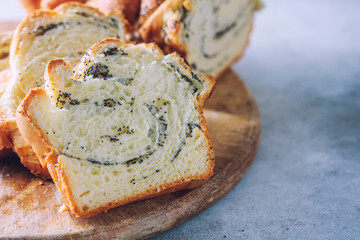 Homemade poppy seed braided bread, selective focus . Wreath. National pastries.
