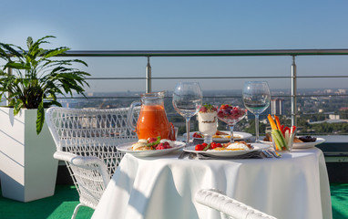 Breakfast, served table on the balcony
