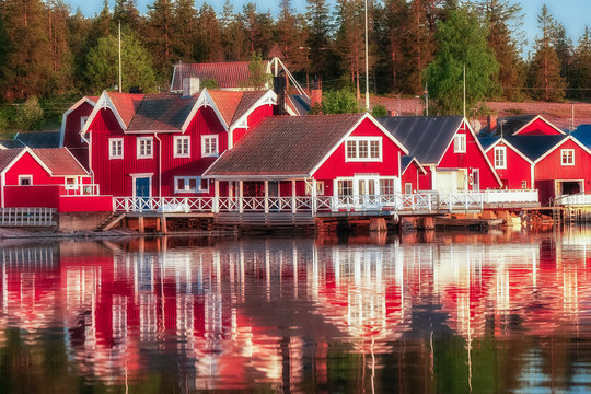 red houses at sunset in the  fishing village of Norfaellsviken, Höga Kusten, Sweden