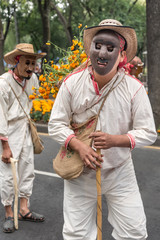 Dead cropper costume in Mexico. Participant using clay mask in the Day of the dead tradition in Mexico