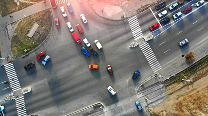 City car traffic on a crossroad. Aerial.