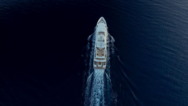 Top-down view of large super yacht underway