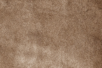 Fototapeta na wymiar Natural leather surface in brown tone.