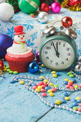 Christmas cupcakes with colored decorations, blurred background